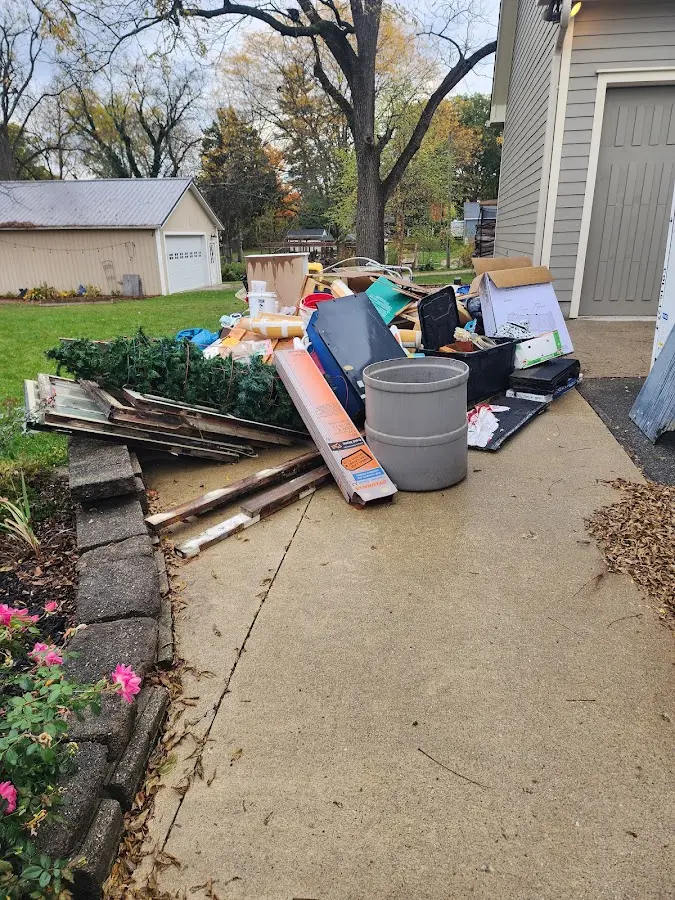 Dumpster being loaded with debris for Estate Cleanout Dumpster Rental in Hastings-on-Hudson